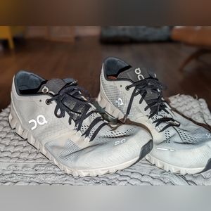 On cloud men's running shoes. Size 11. White in color. Lightly used.